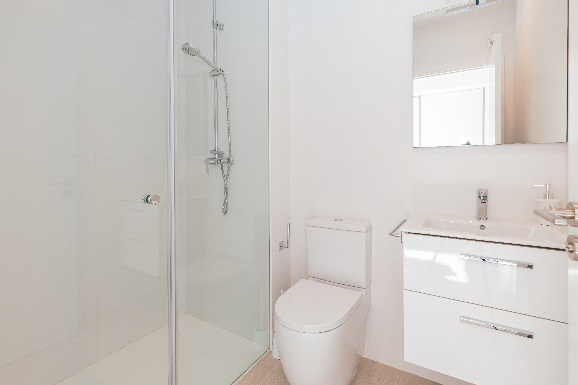 Bright white bathroom with walk-in shower